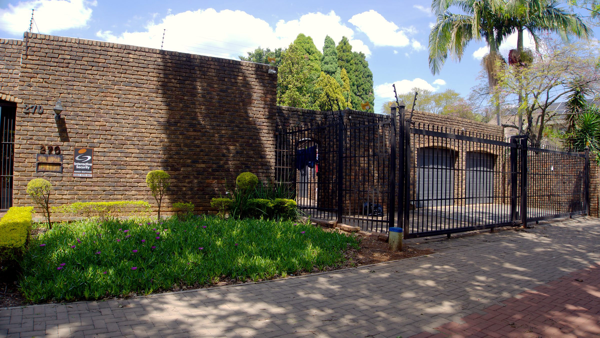 The street frontage and gated entrance at 270 Hay Street